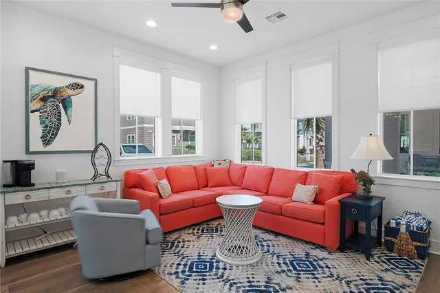 a dining room with furniture a rug and a chandelier
