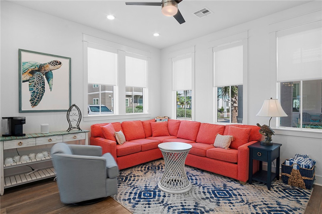 214 Sunset Avenue, Unit 2 Port Aransas, TX 78373 - Photo 6 of 37 a living room with furniture and a large window