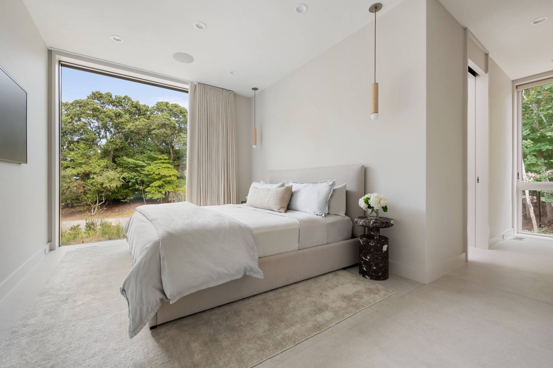 232 Kings Point Road East Hampton, NY 11937 - Photo 11 of 37 a bed room with a bed and a large window