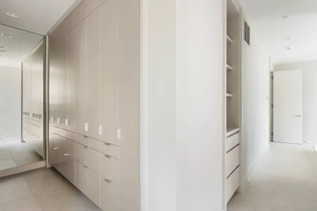 a bathroom with a double vanity sink and mirror