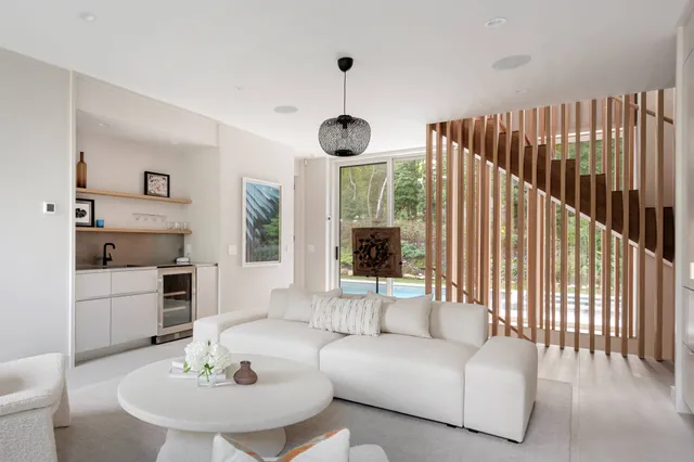 a bedroom with a large bed and a large window