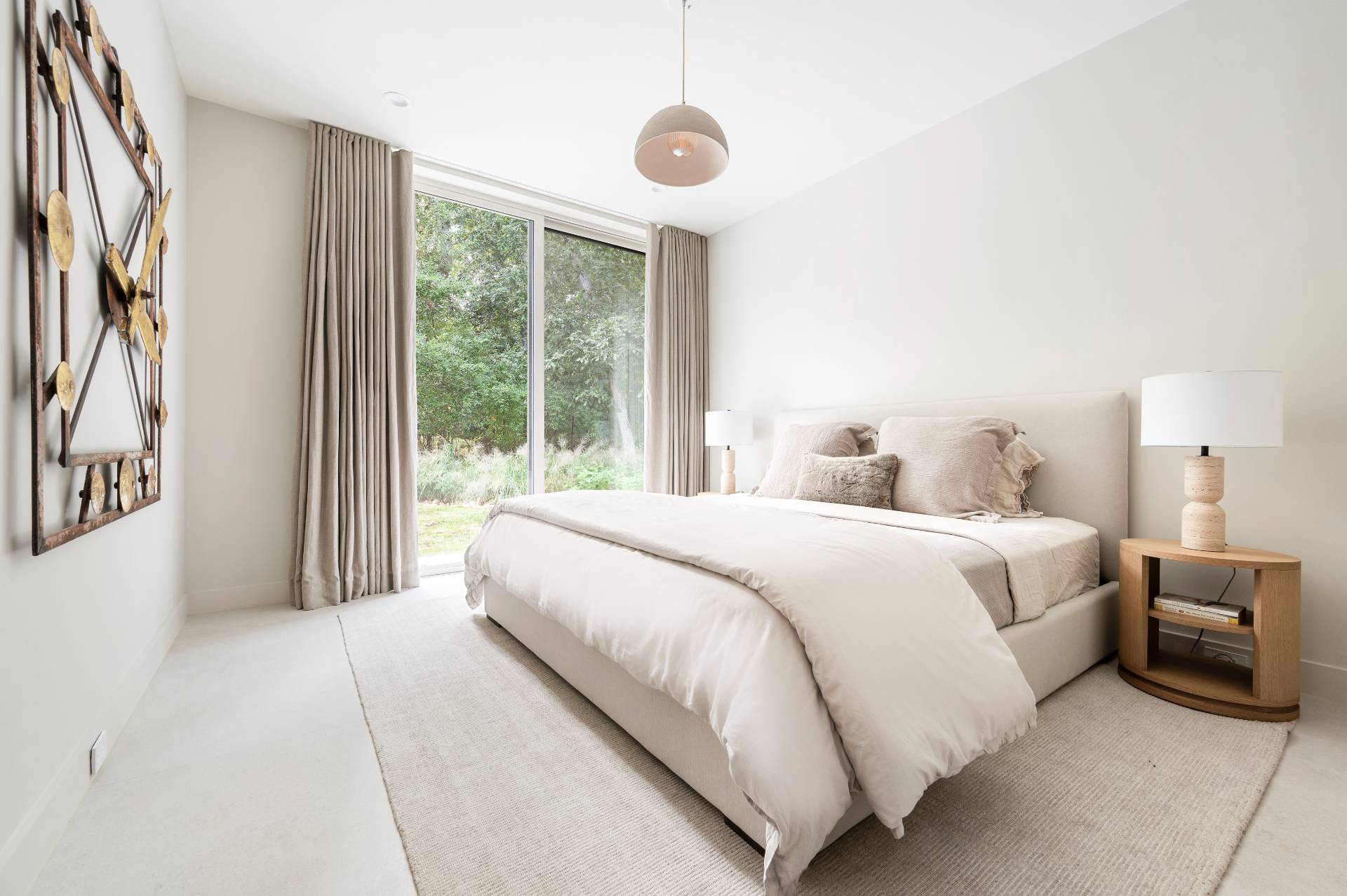 232 Kings Point Road East Hampton, NY 11937 - Photo 18 of 37 a bedroom with a large bed and a large window