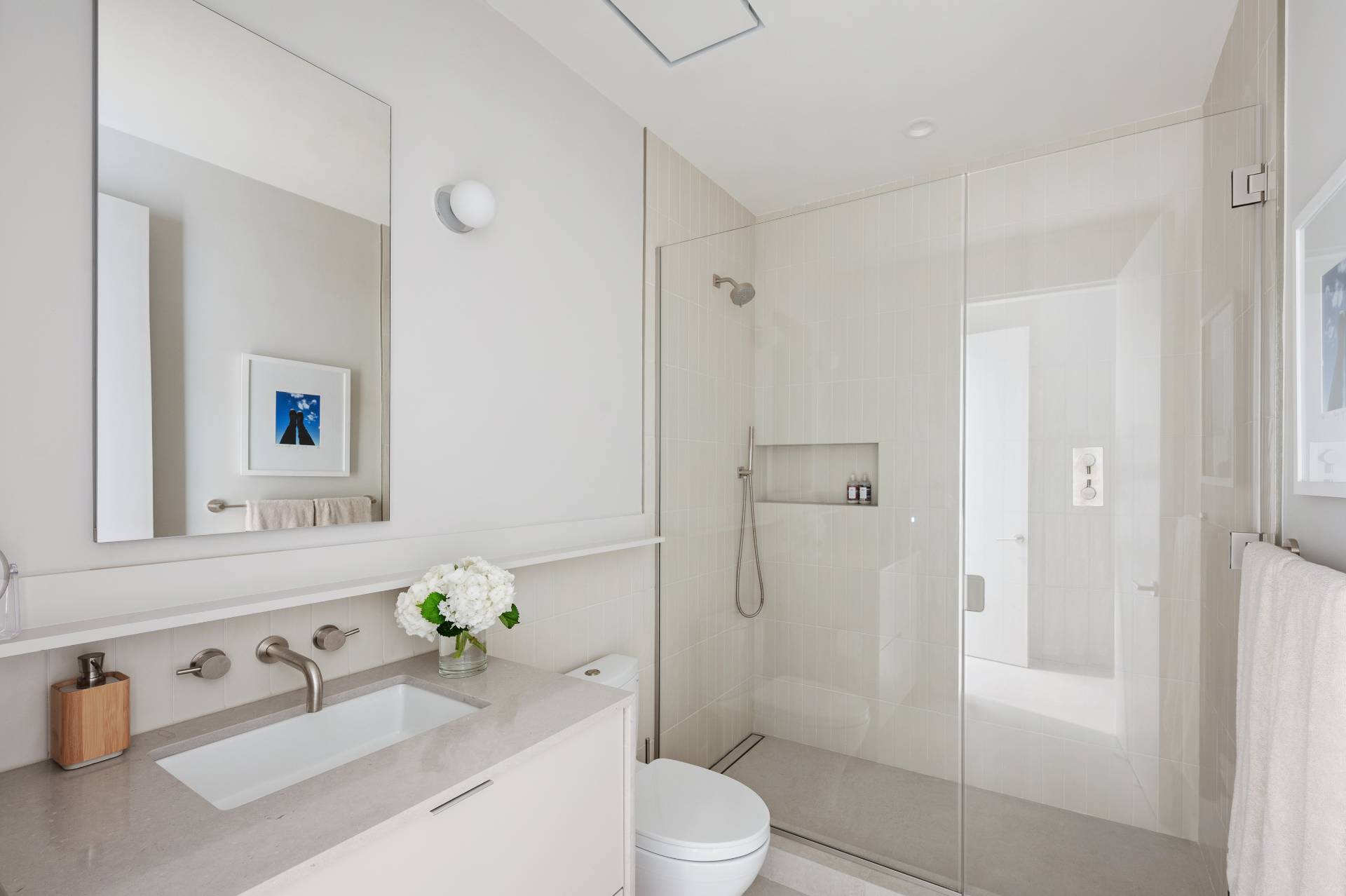 232 Kings Point Road East Hampton, NY 11937 - Photo 19 of 37 a white toilet sitting next to a bathroom sink