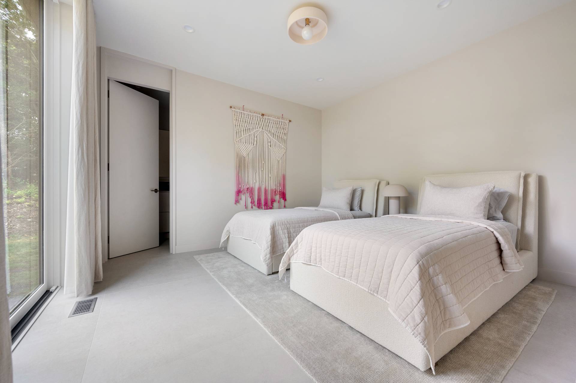 232 Kings Point Road East Hampton, NY 11937 - Photo 20 of 37 a bedroom with a bed and a mirror