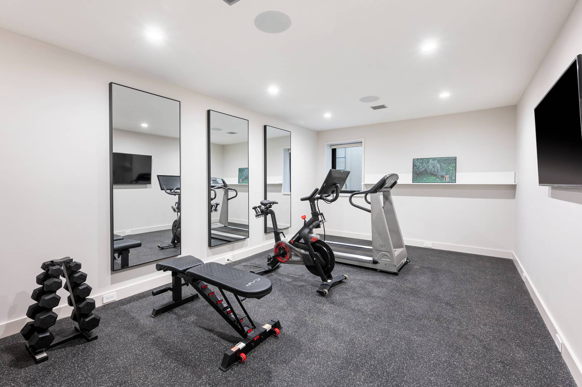 232 Kings Point Road East Hampton, NY 11937 - Photo 25 of 37 a view of a room with gym equipment