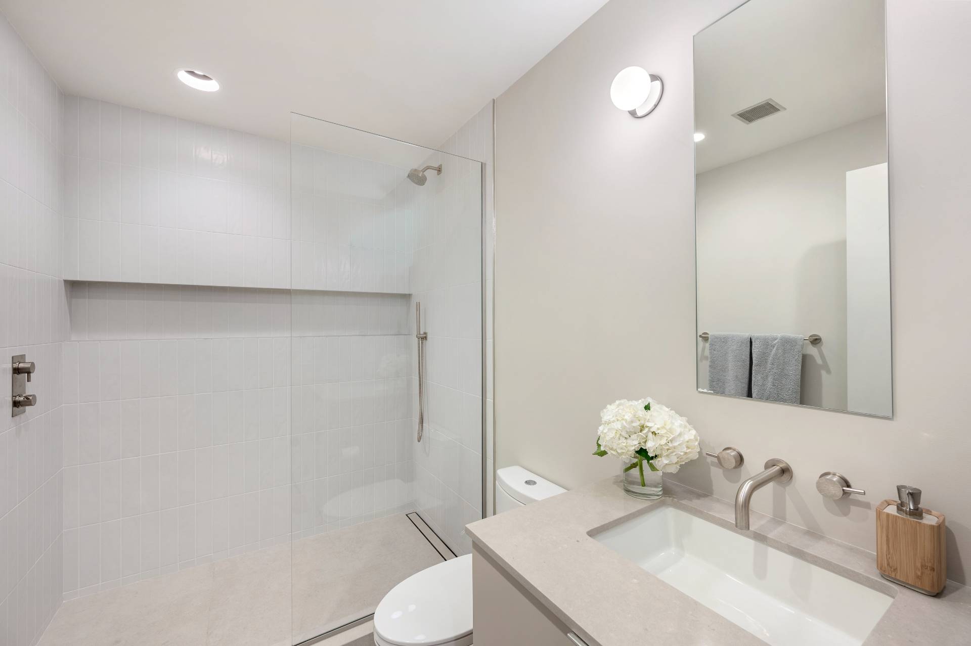 232 Kings Point Road East Hampton, NY 11937 - Photo 28 of 37 a bathroom with a sink vanity mirror and toilet