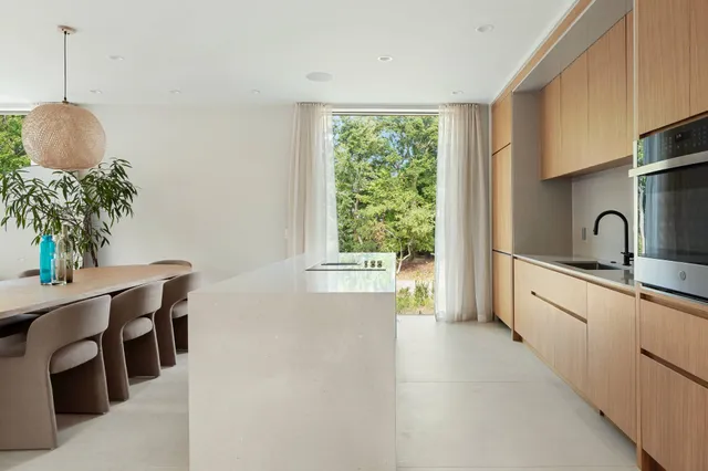 a kitchen with windows and sink