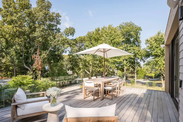 an outdoor space with furniture and umbrella