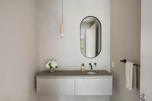 a bed room with a bed and a large window