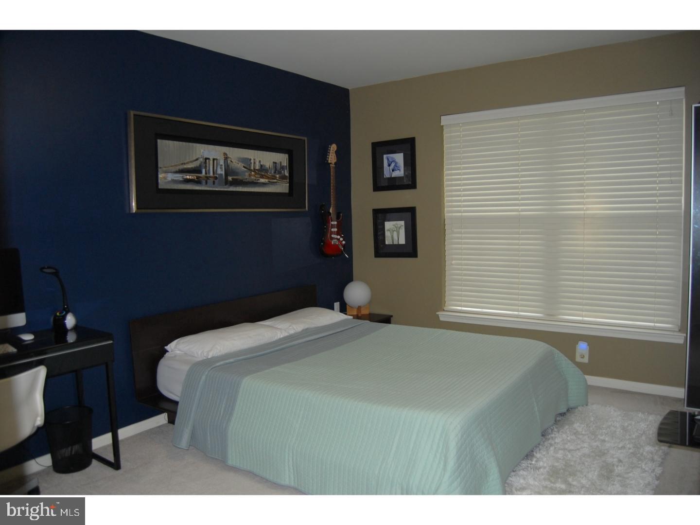 28 Madison Way Downingtown, PA 19335 - Photo 12 of 44 a bedroom with a bed and a window