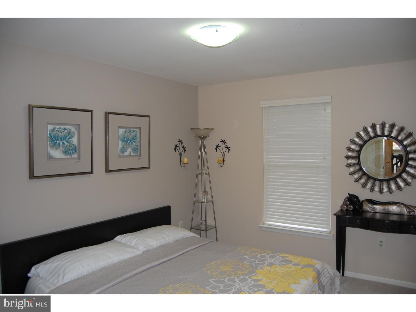 28 Madison Way Downingtown, PA 19335 - Photo 13 of 44 a bedroom with a bed and a window