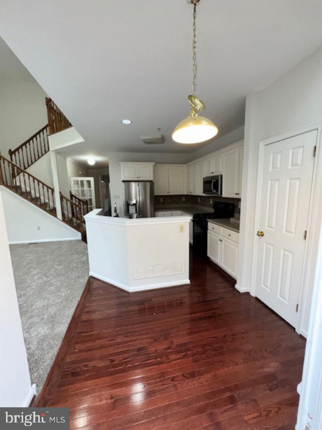 28 Madison Way Downingtown, PA 19335 - Photo 23 of 44 a view of a room with wooden floor and a kitchen