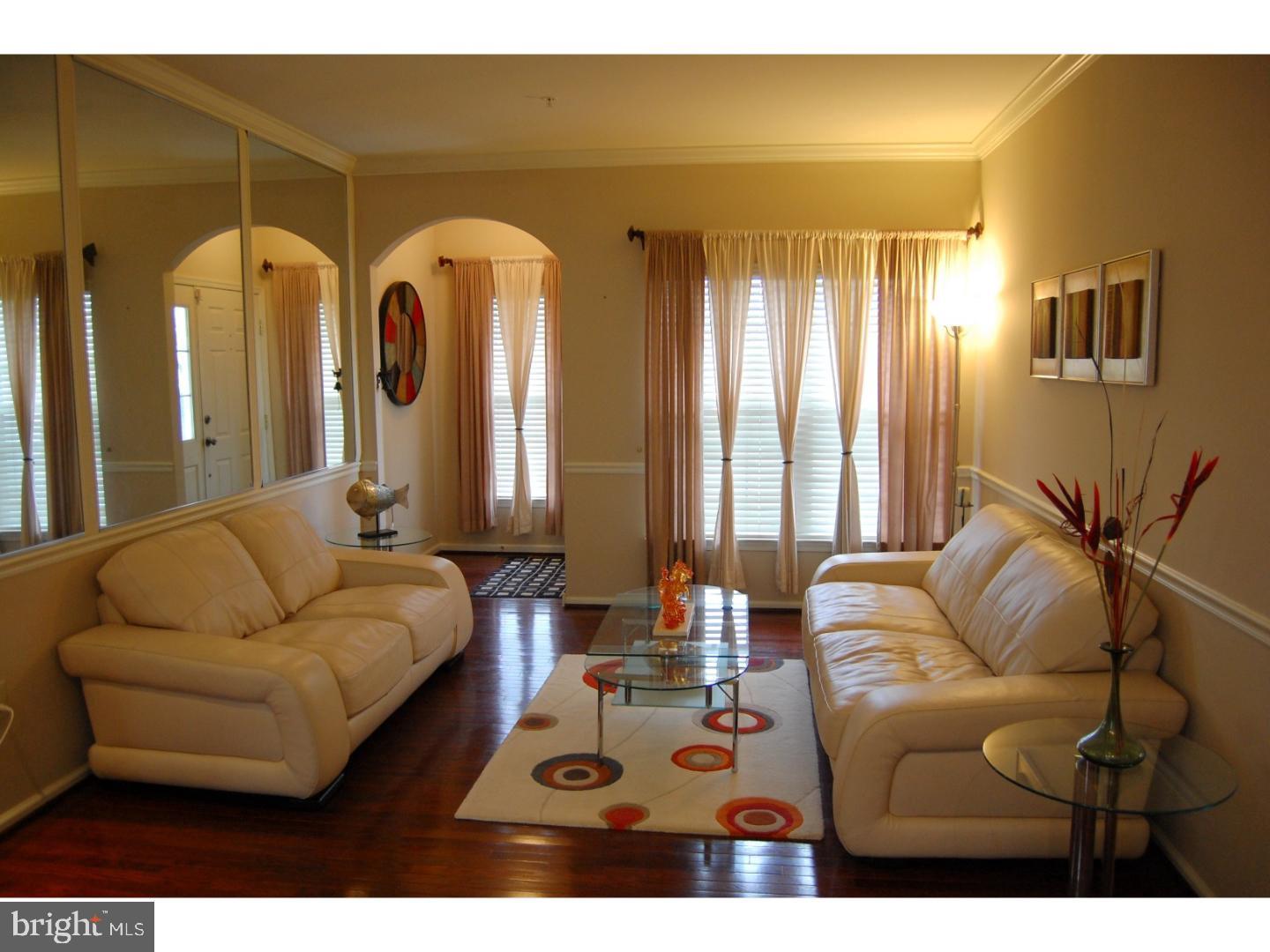 28 Madison Way Downingtown, PA 19335 - Photo 4 of 44 a living room with furniture and a large window