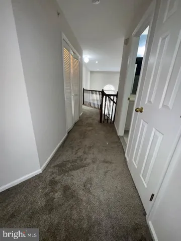 a picture of a bench in front of a wall