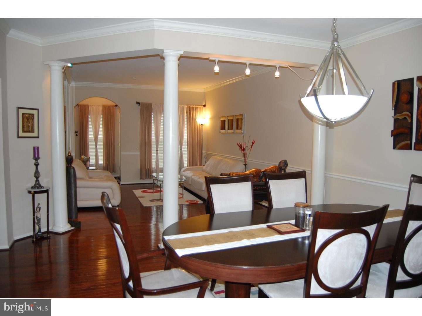 28 Madison Way Downingtown, PA 19335 - Photo 6 of 44 a living room with furniture a chandelier a mirror and a table