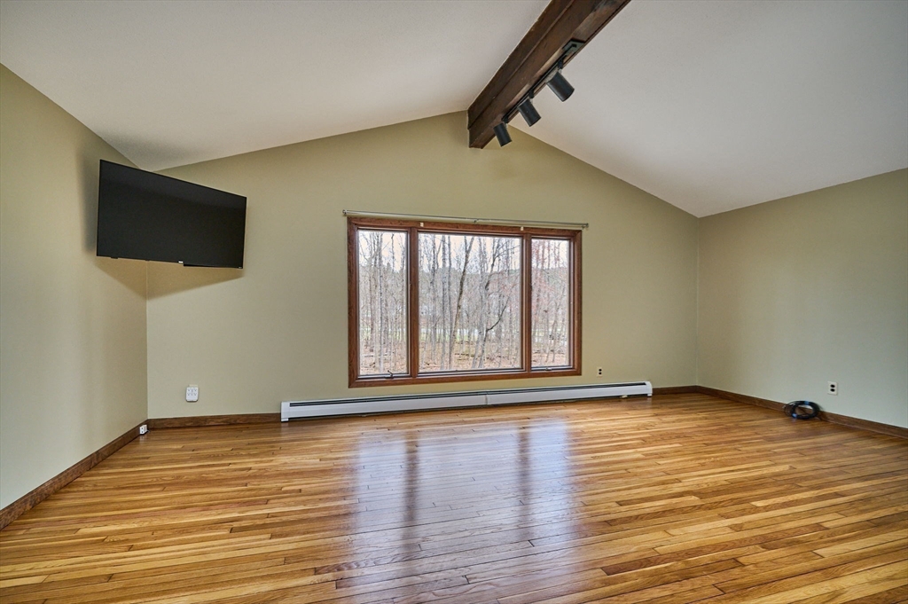 14 East Hawley Road Charlemont, MA 01339 - Photo 13 of 42 a view of an empty room with wooden floor and a window