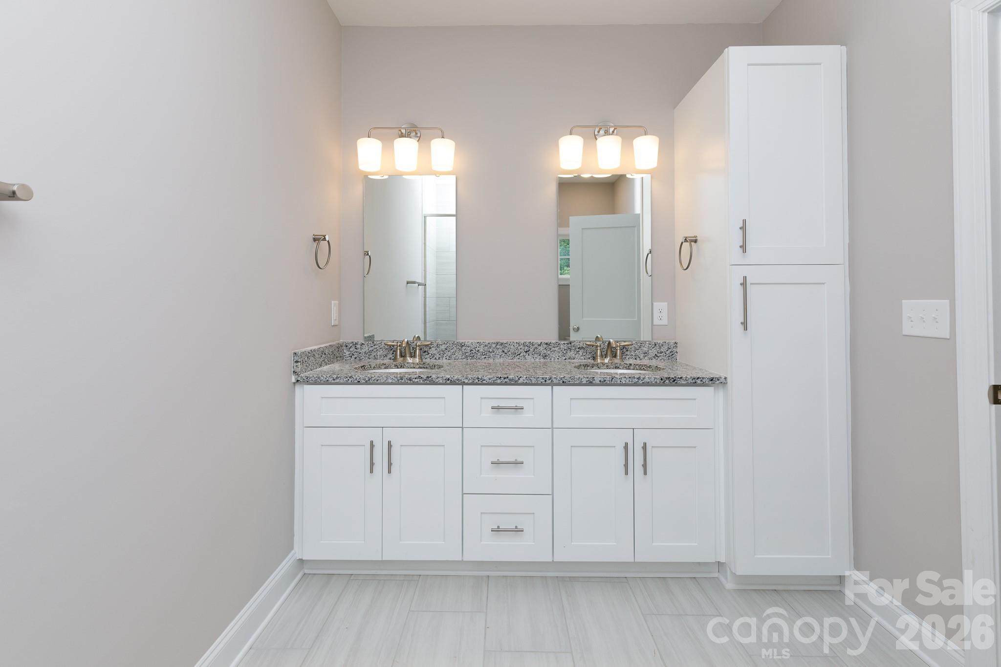 2902 Peden Bridge Road Chester, SC 29706 - Photo 26 of 44 a bathroom with a granite countertop sink and a mirror