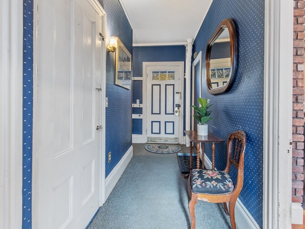 12 Spring Street Foxboro, MA 02035 - Photo 6 of 42 a view of an entryway with furniture and livingroom