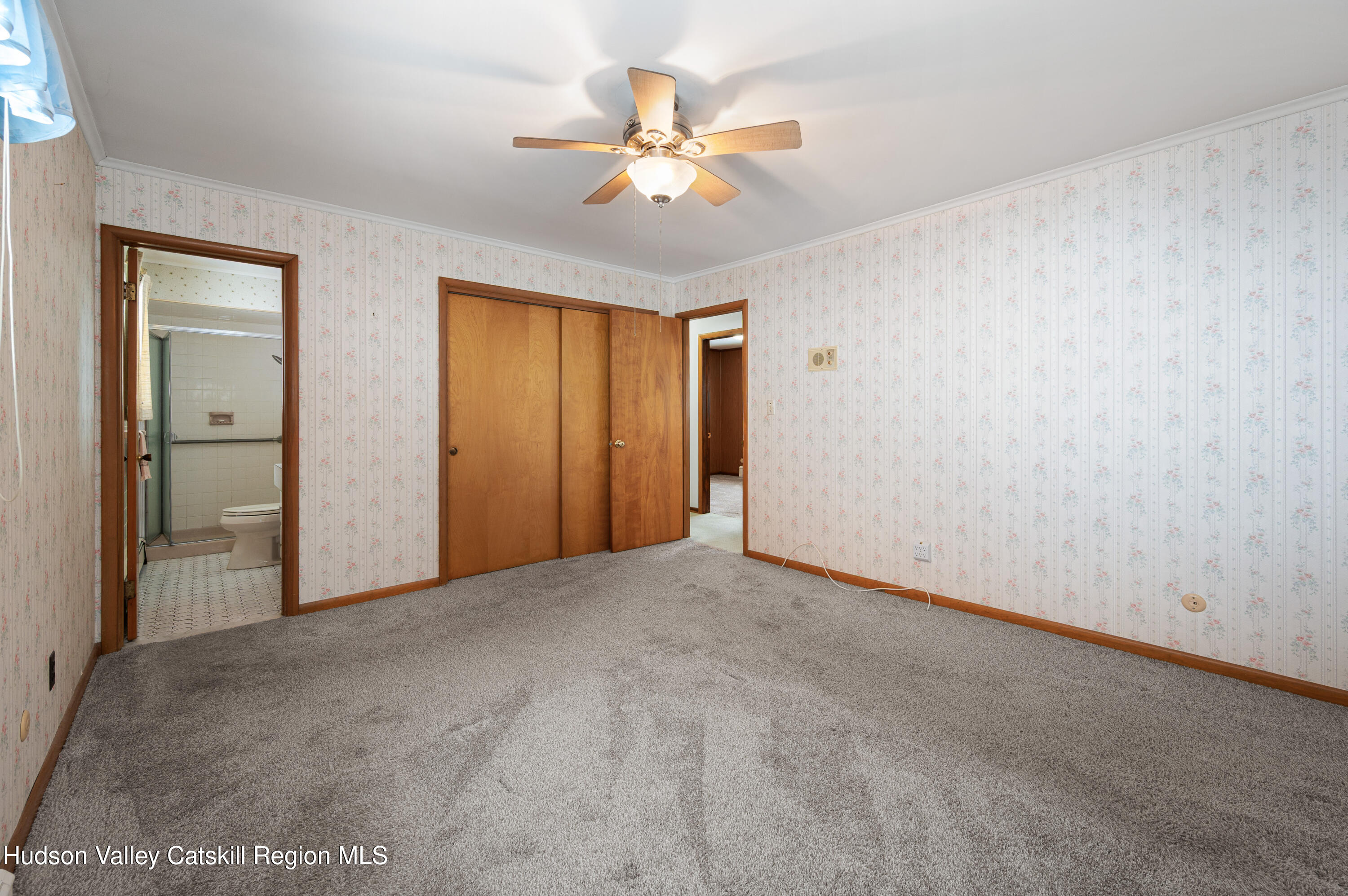108 River Road Ulster Park, NY 12487 - Photo 13 of 32 an empty room with closet and a ceiling fan
