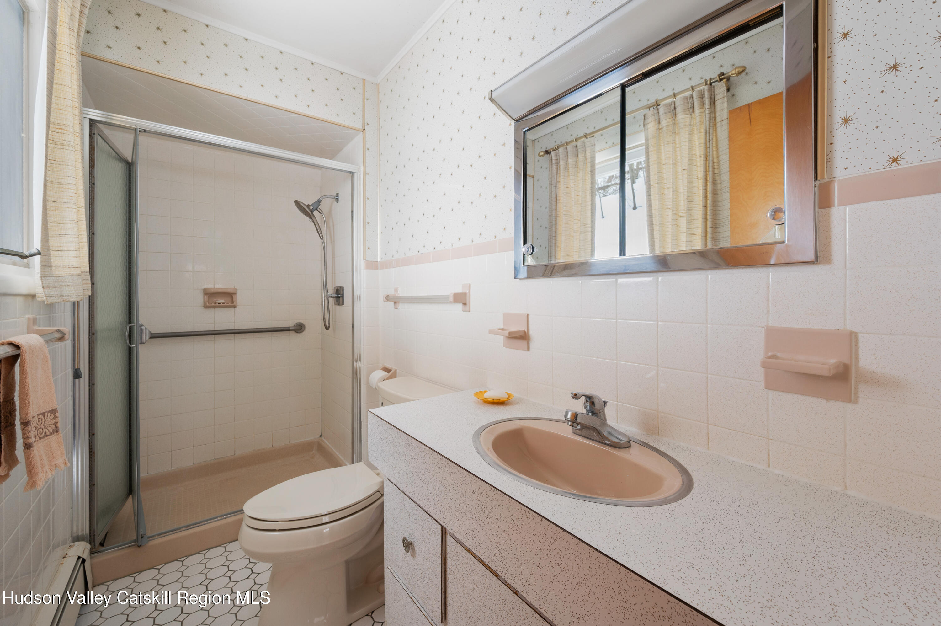 108 River Road Ulster Park, NY 12487 - Photo 14 of 32 a bathroom with a sink a toilet and shower