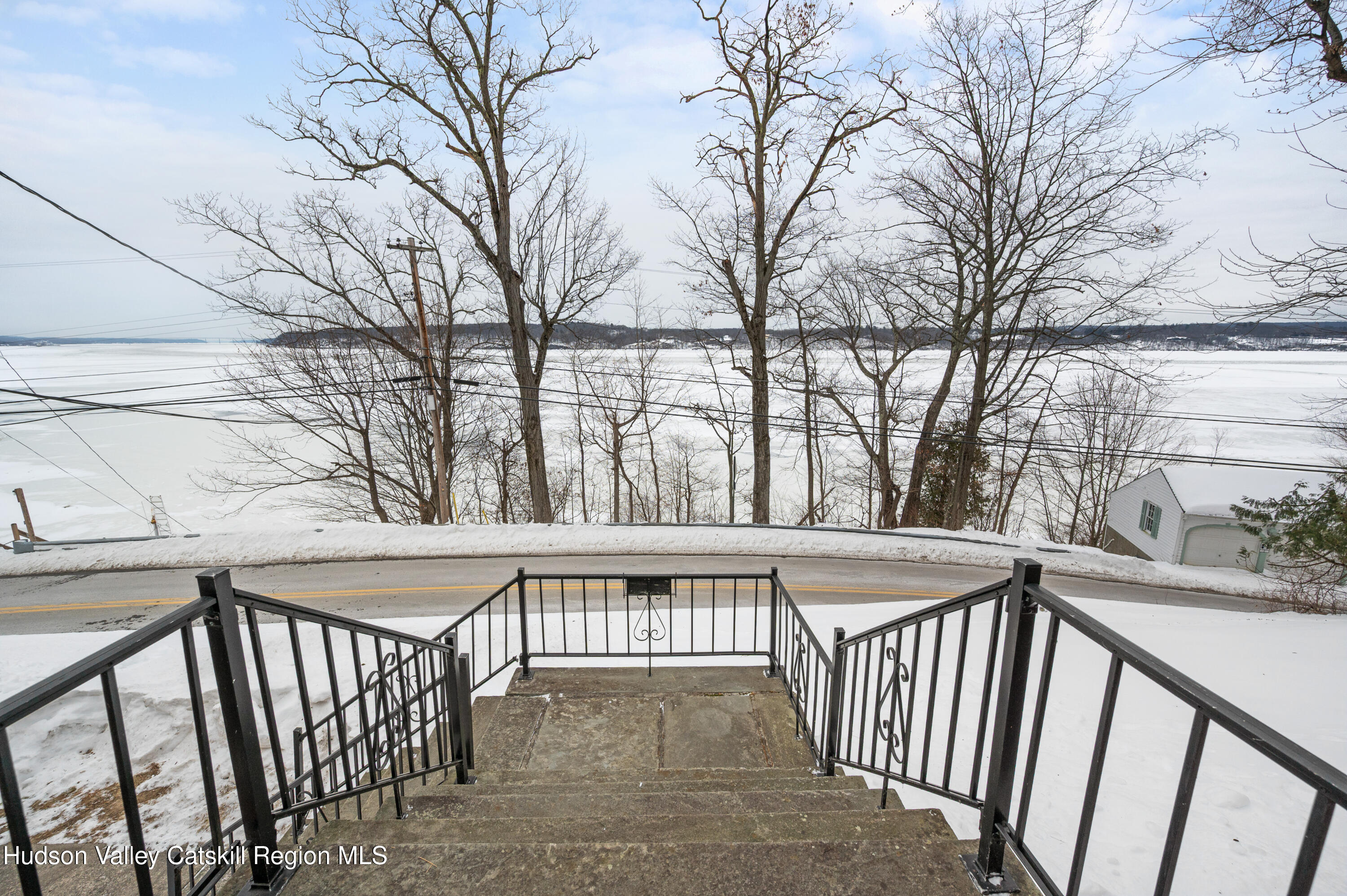 108 River Road Ulster Park, NY 12487 - Photo 2 of 32 a view of a balcony with wooden fence and floor