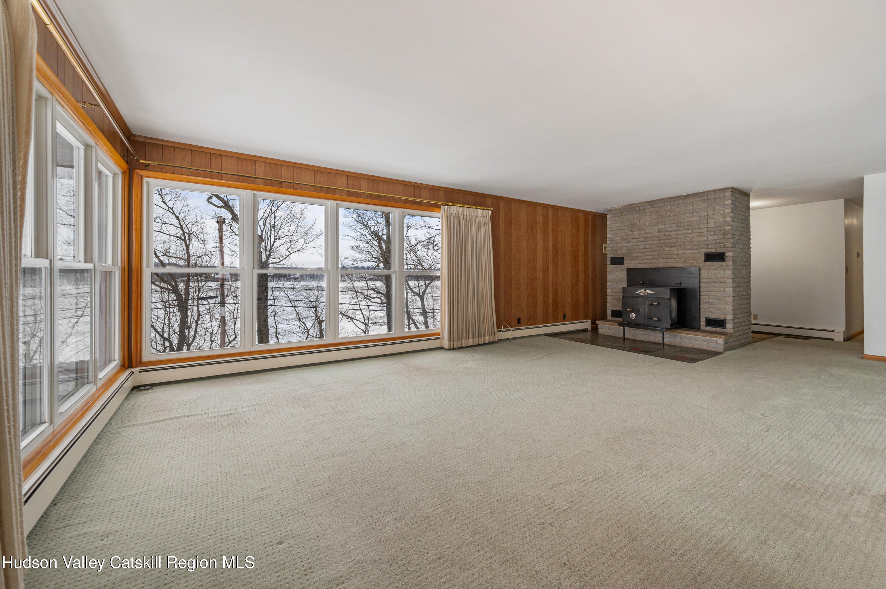 108 River Road Ulster Park, NY 12487 - Photo 6 of 32 an empty room with furniture and large window
