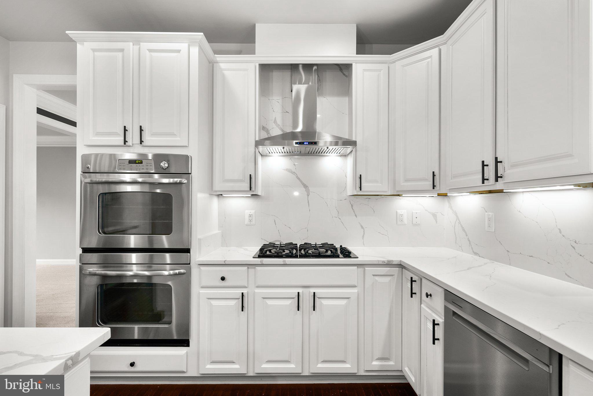 8304 Cedarview Court Clinton, MD 20735 - Photo 12 of 39 a kitchen with appliances a sink and cabinets