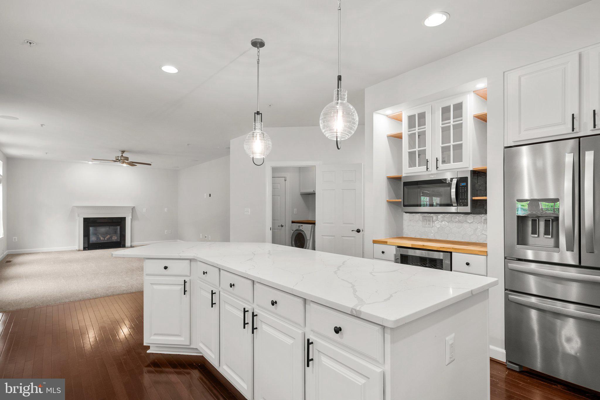 8304 Cedarview Court Clinton, MD 20735 - Photo 13 of 39 a large kitchen with cabinets and stainless steel appliances