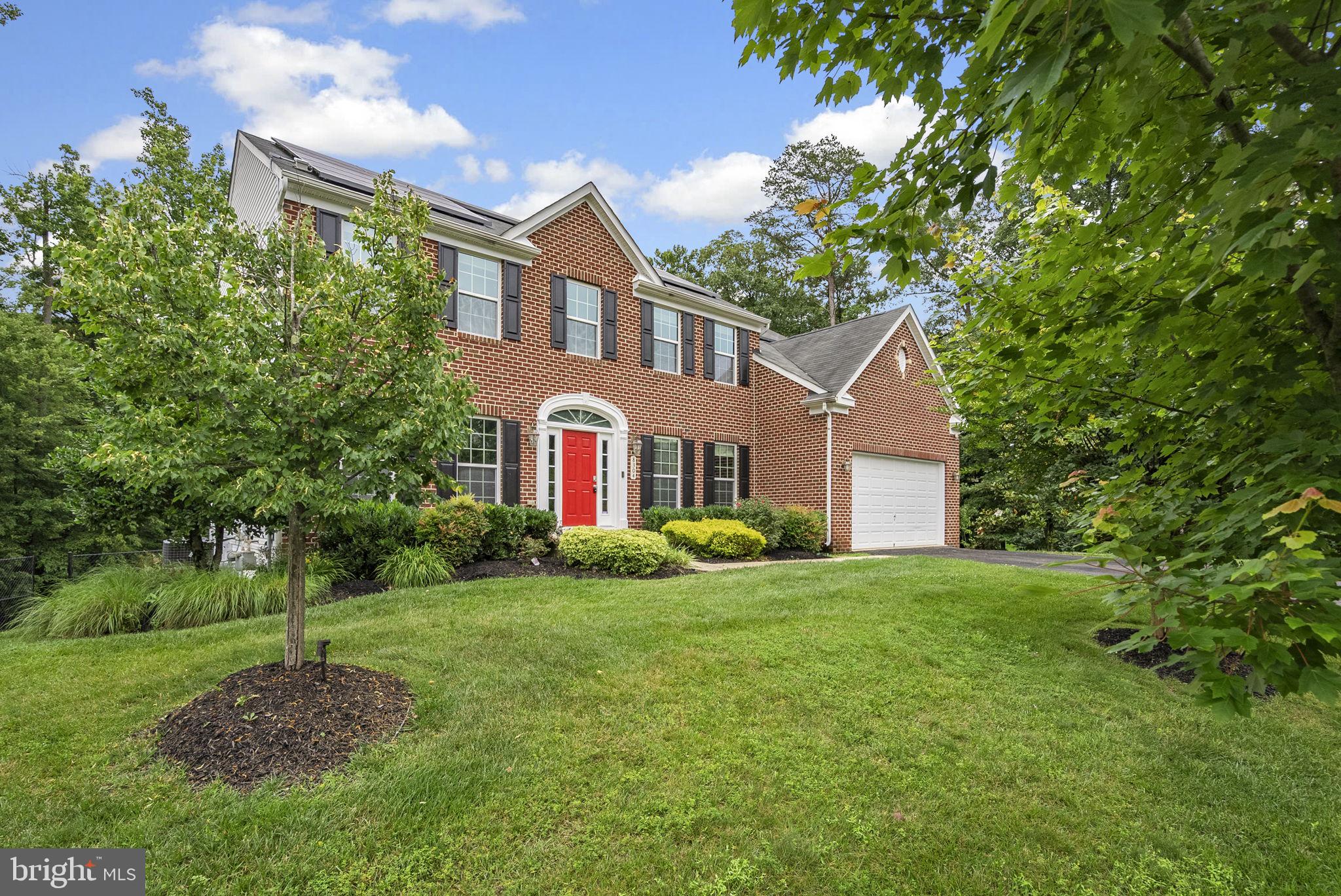 8304 Cedarview Court Clinton, MD 20735 - Photo 3 of 39 a front view of a house with garden