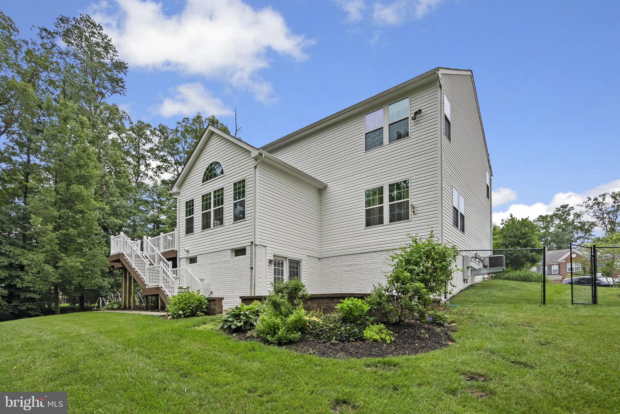 8304 Cedarview Court Clinton, MD 20735 - Photo 32 of 39 a view of a backyard with plants and a garden