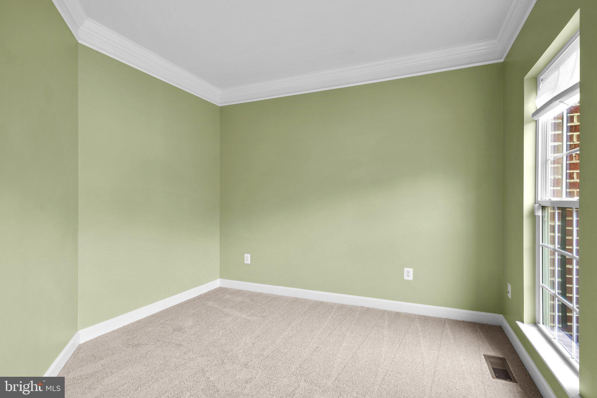 8304 Cedarview Court Clinton, MD 20735 - Photo 5 of 39 an empty room with wooden floor and windows