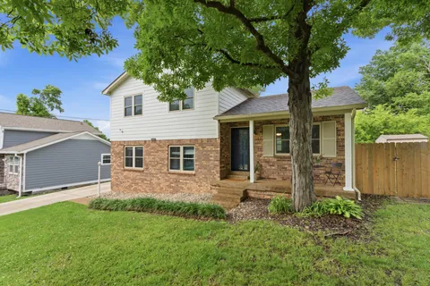 front view of a house with a yard