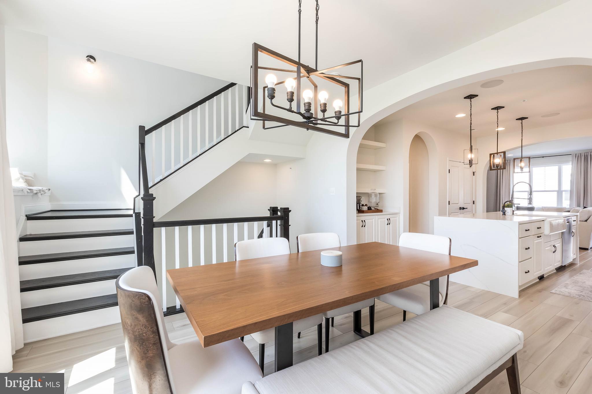 1096 Holden Road Frederick, MD 21701 - Photo 12 of 51 a view of a dining room with furniture and a chandelier
