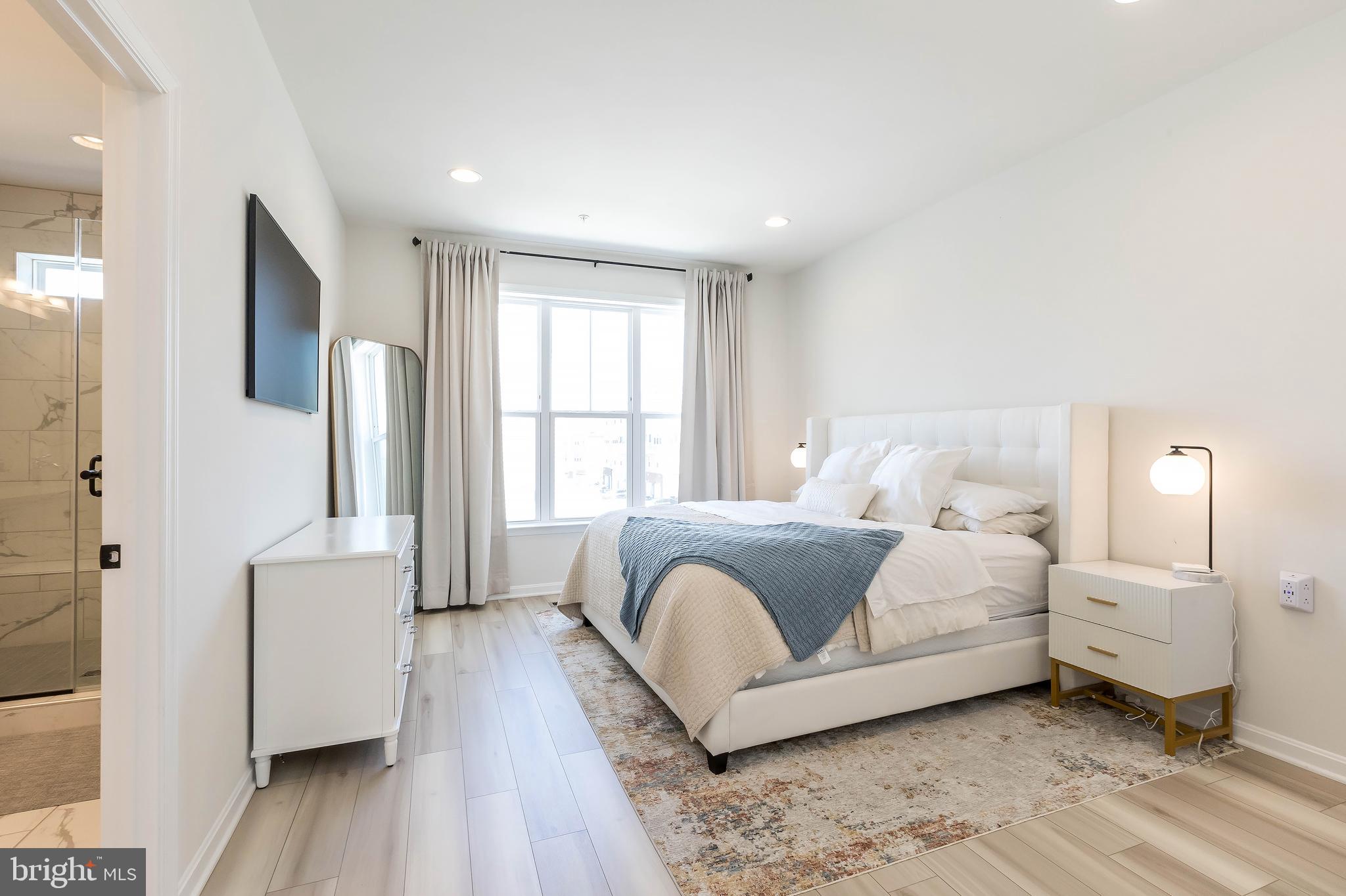 1096 Holden Road Frederick, MD 21701 - Photo 23 of 51 a bedroom with a bed and a large window