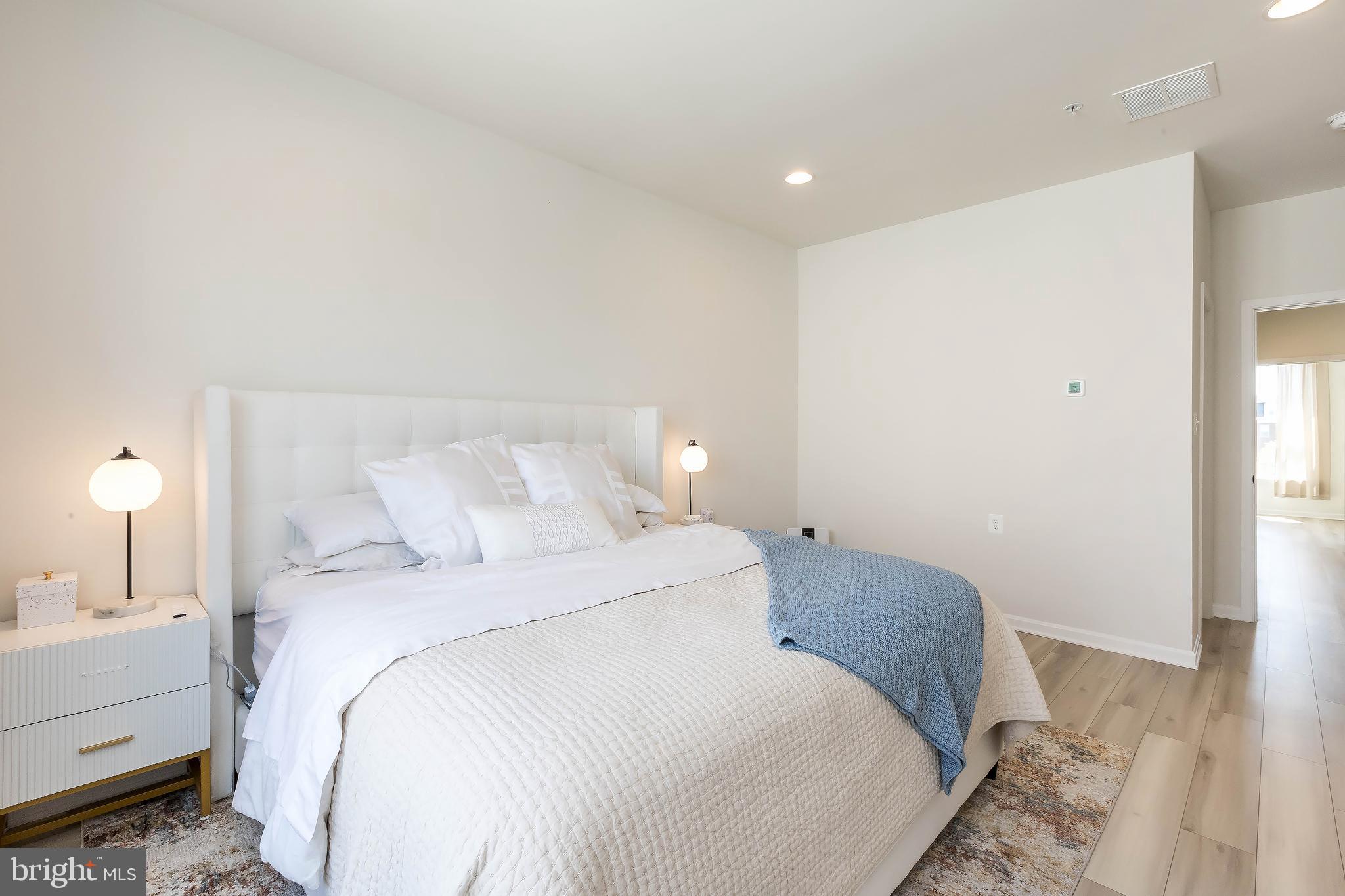 1096 Holden Road Frederick, MD 21701 - Photo 25 of 51 a bedroom with a bed and a night stand