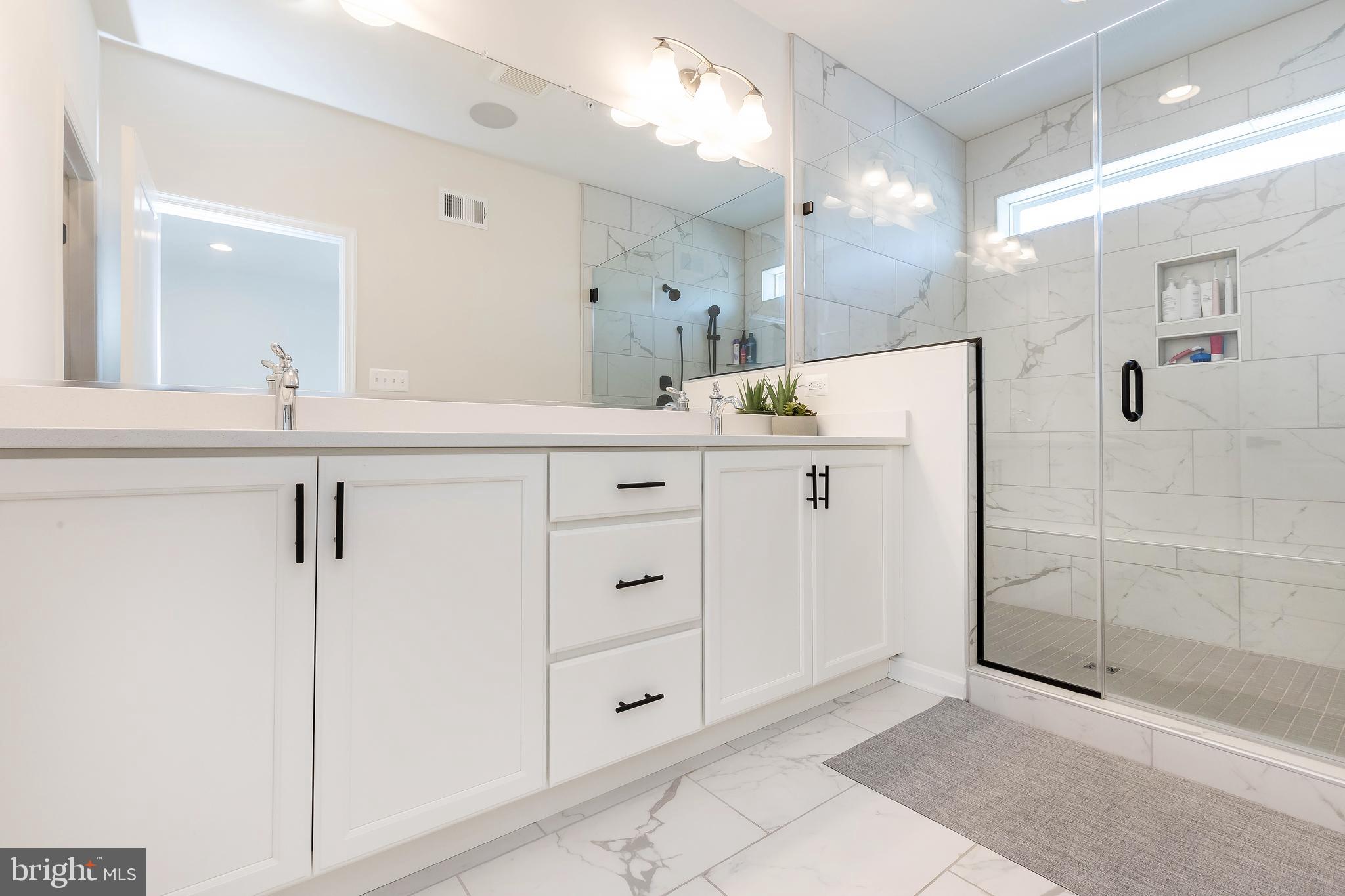 1096 Holden Road Frederick, MD 21701 - Photo 26 of 51 a bathroom with a shower sink and mirror