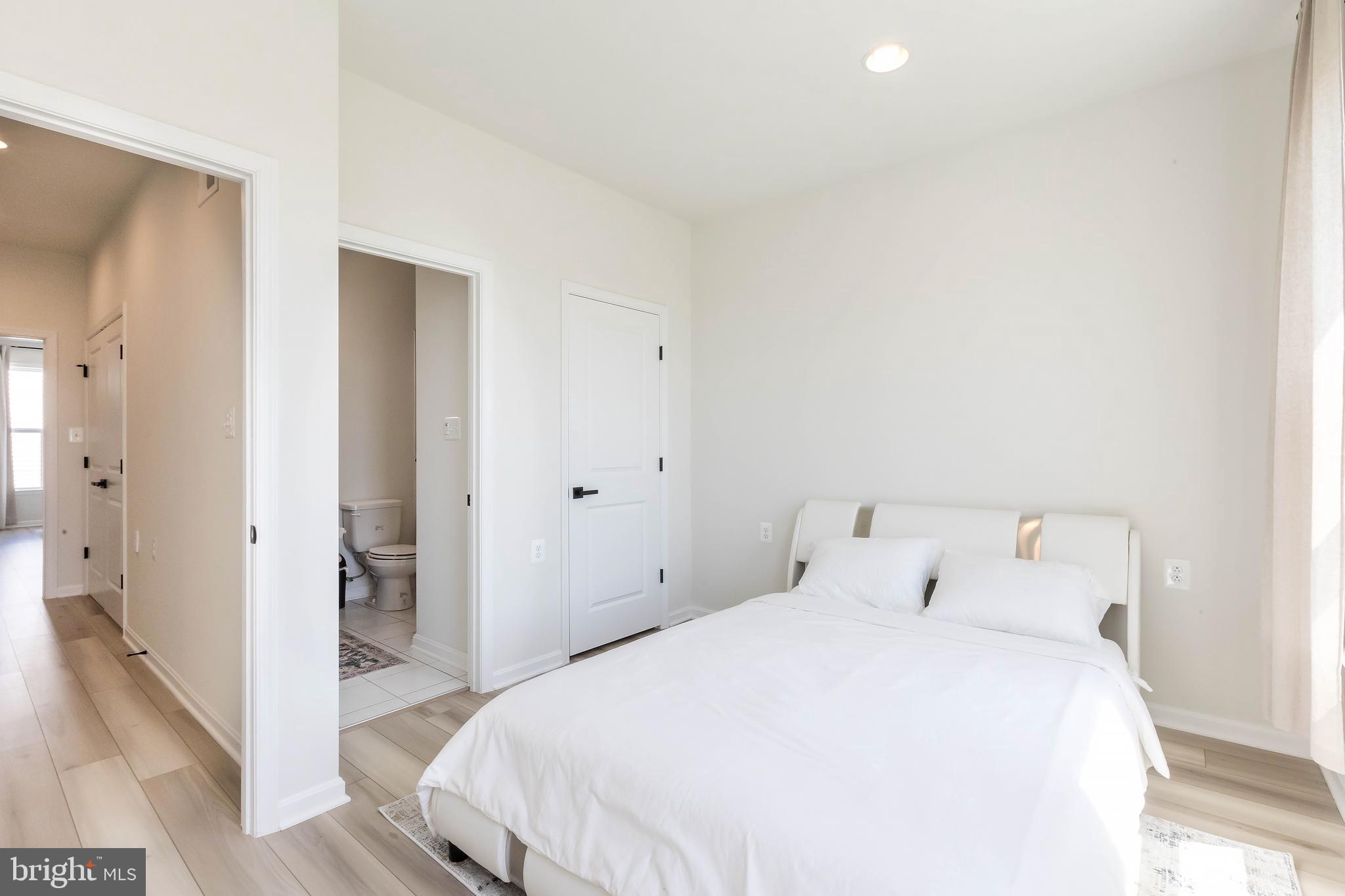 1096 Holden Road Frederick, MD 21701 - Photo 30 of 51 a bedroom with a bed and a hallway