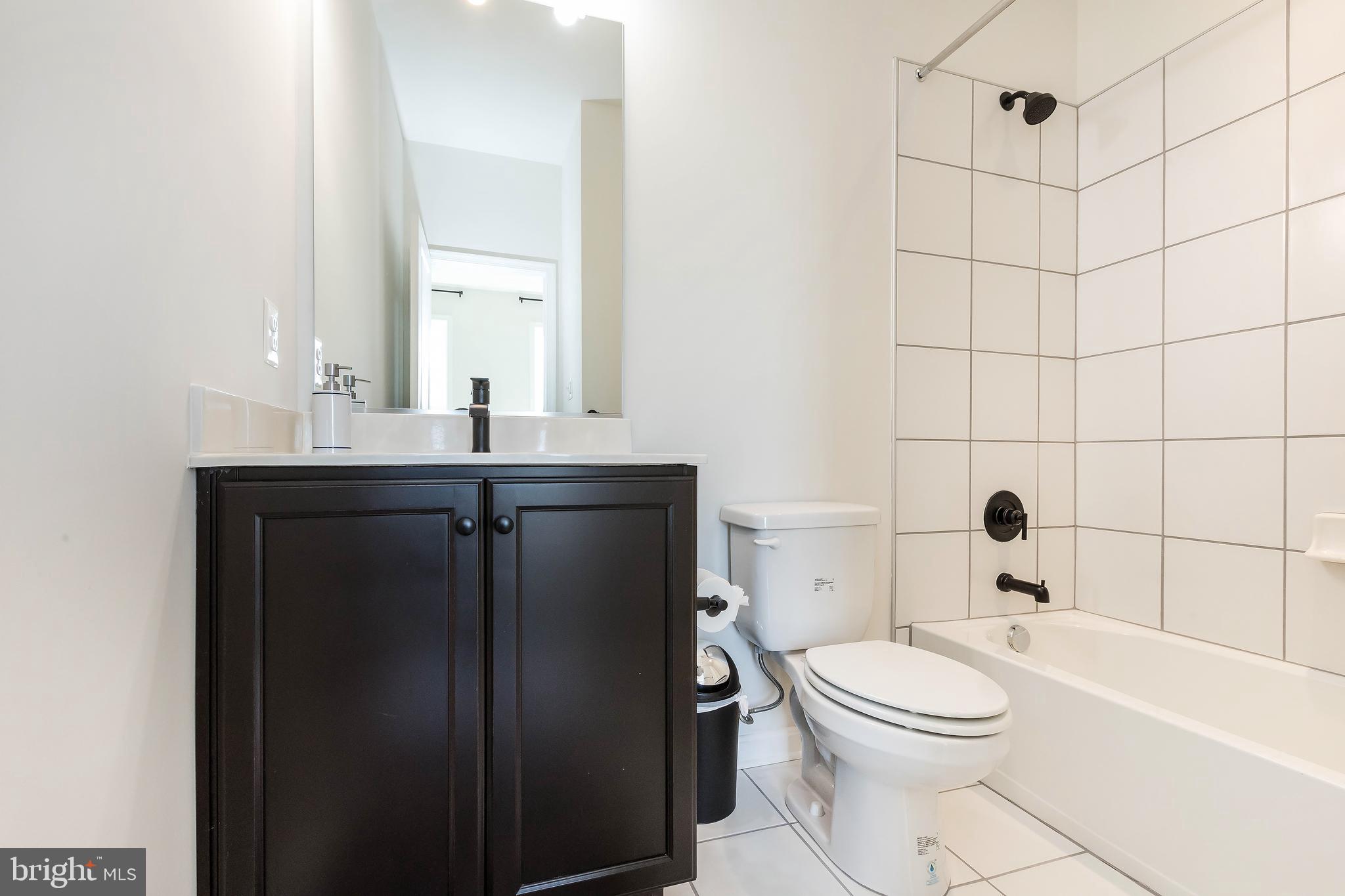 1096 Holden Road Frederick, MD 21701 - Photo 31 of 51 a bathroom with a sink a toilet and shower