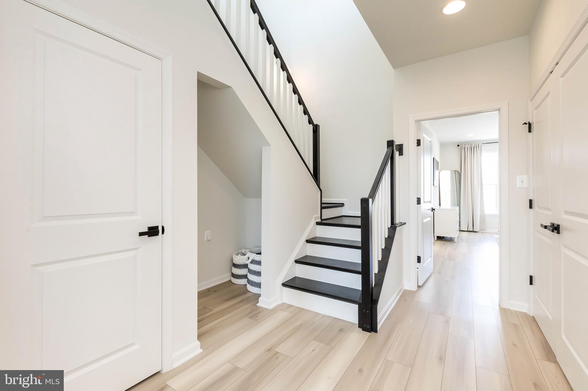 1096 Holden Road Frederick, MD 21701 - Photo 32 of 51 a view of a hallway with wooden floor and staircase