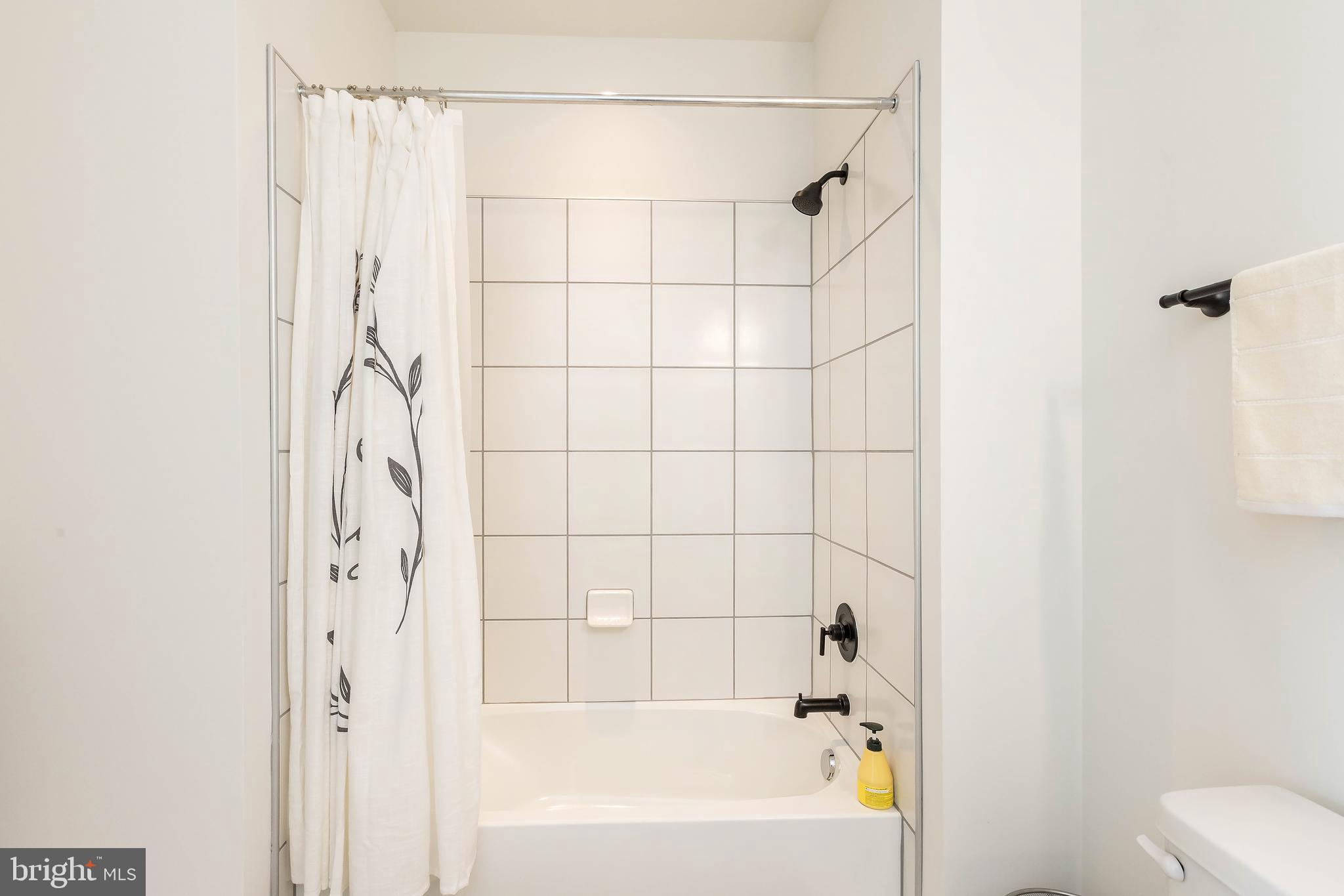 1096 Holden Road Frederick, MD 21701 - Photo 37 of 51 a bathroom with a bathtub and shower