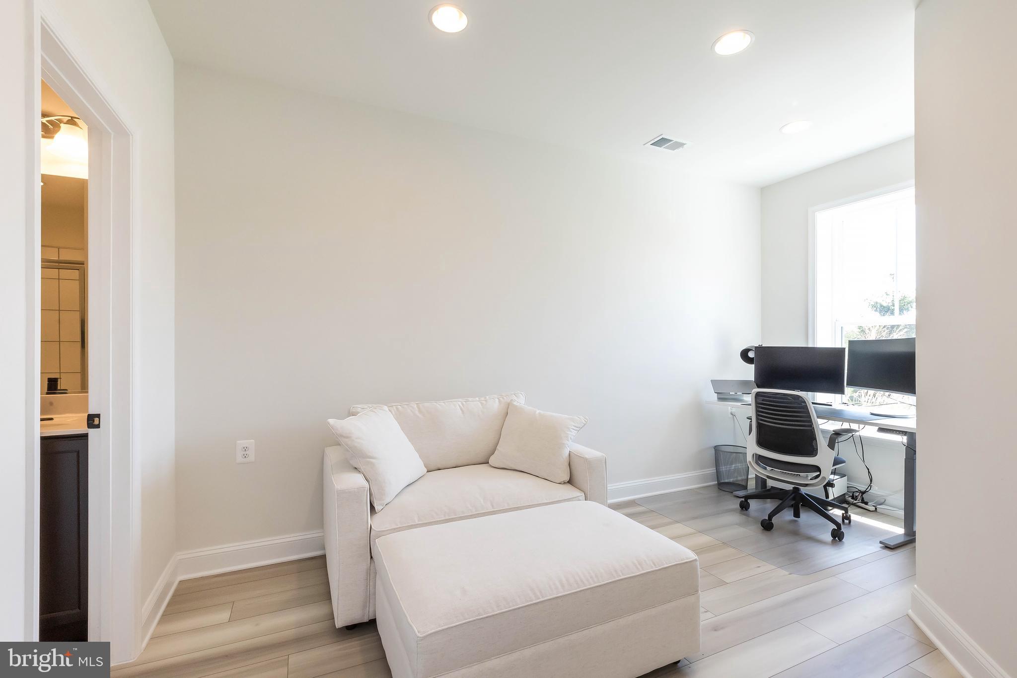 1096 Holden Road Frederick, MD 21701 - Photo 41 of 51 a living room with furniture and a wooden floor