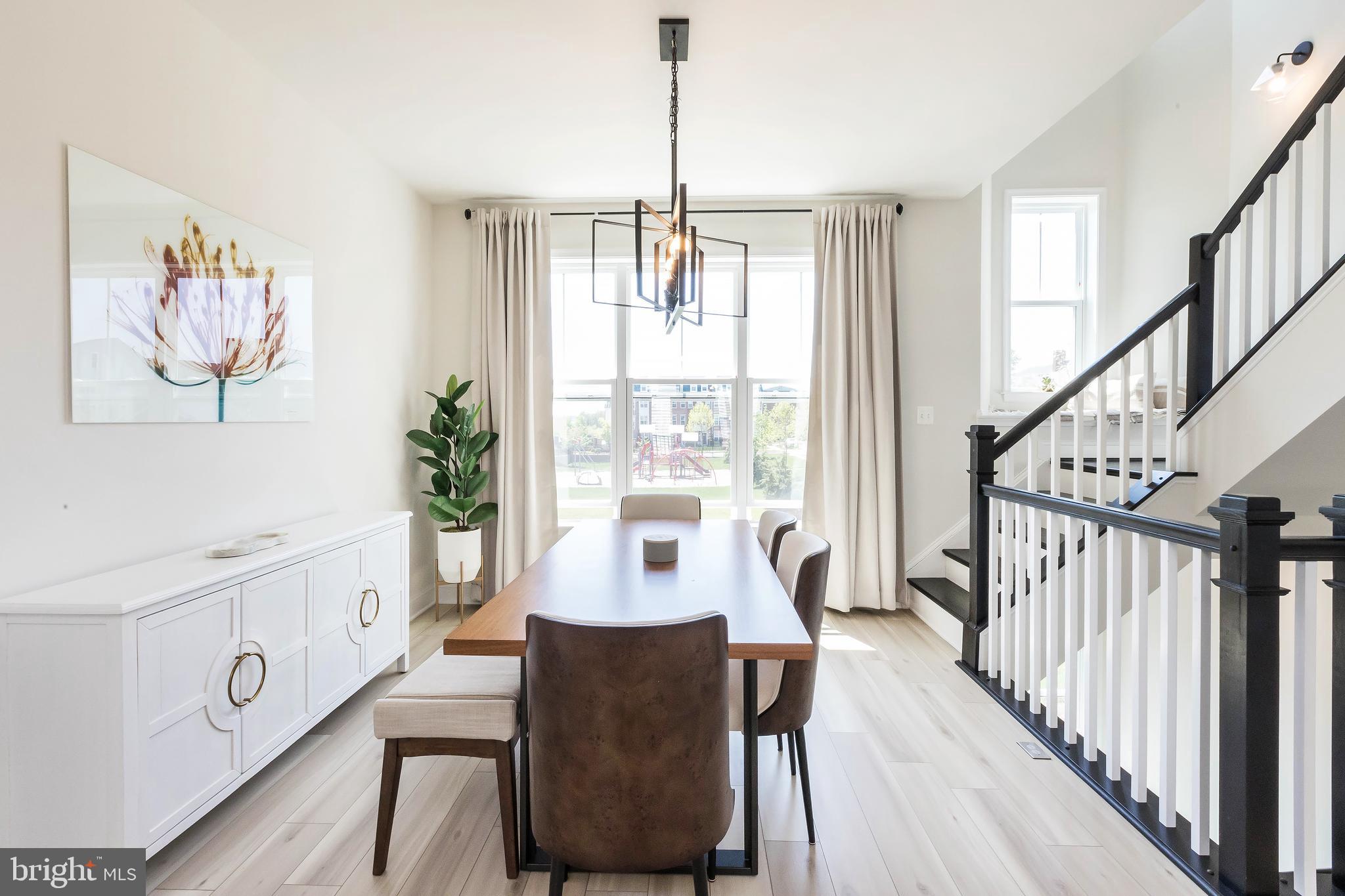 1096 Holden Road Frederick, MD 21701 - Photo 10 of 51 a view of a dining room with furniture window and wooden floor