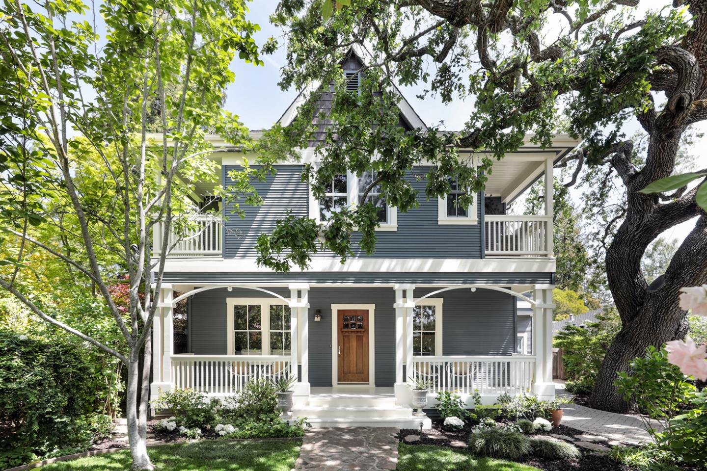 front view of a house with a tree