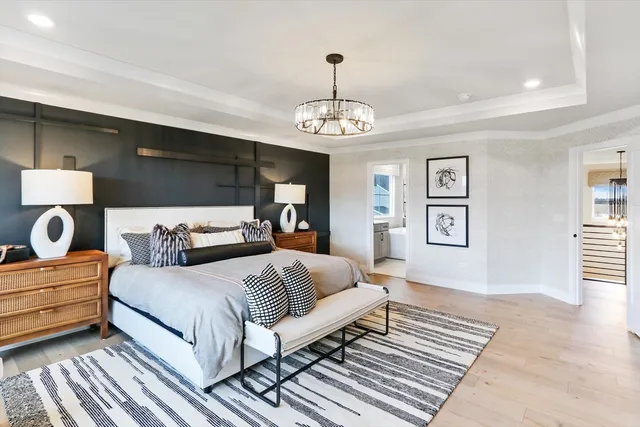 a bedroom with bed and window