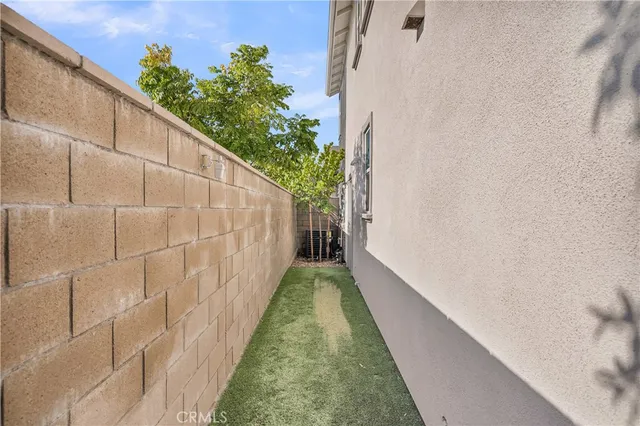 a view of a pathway of a pathway both side of house