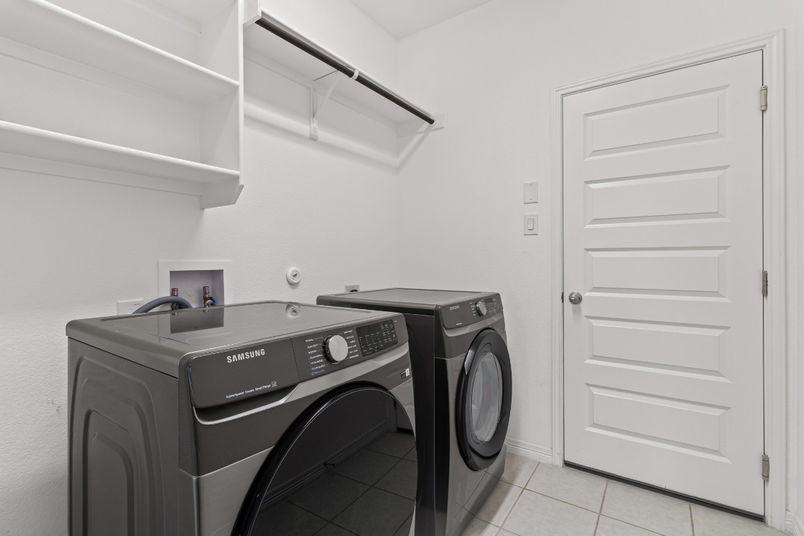 20520 Carries Ranch Road Pflugerville, TX 78660 - Photo 14 of 32 a utility room with dryer and washer