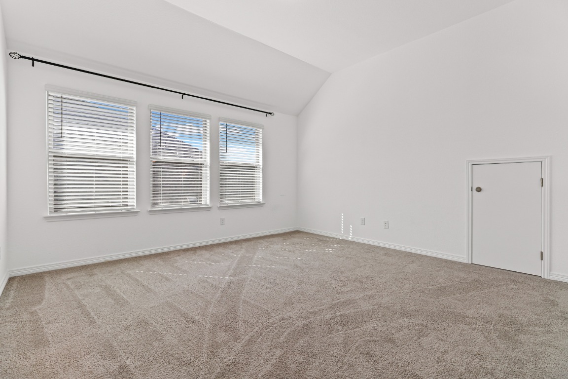 20520 Carries Ranch Road Pflugerville, TX 78660 - Photo 18 of 32 an empty room with windows