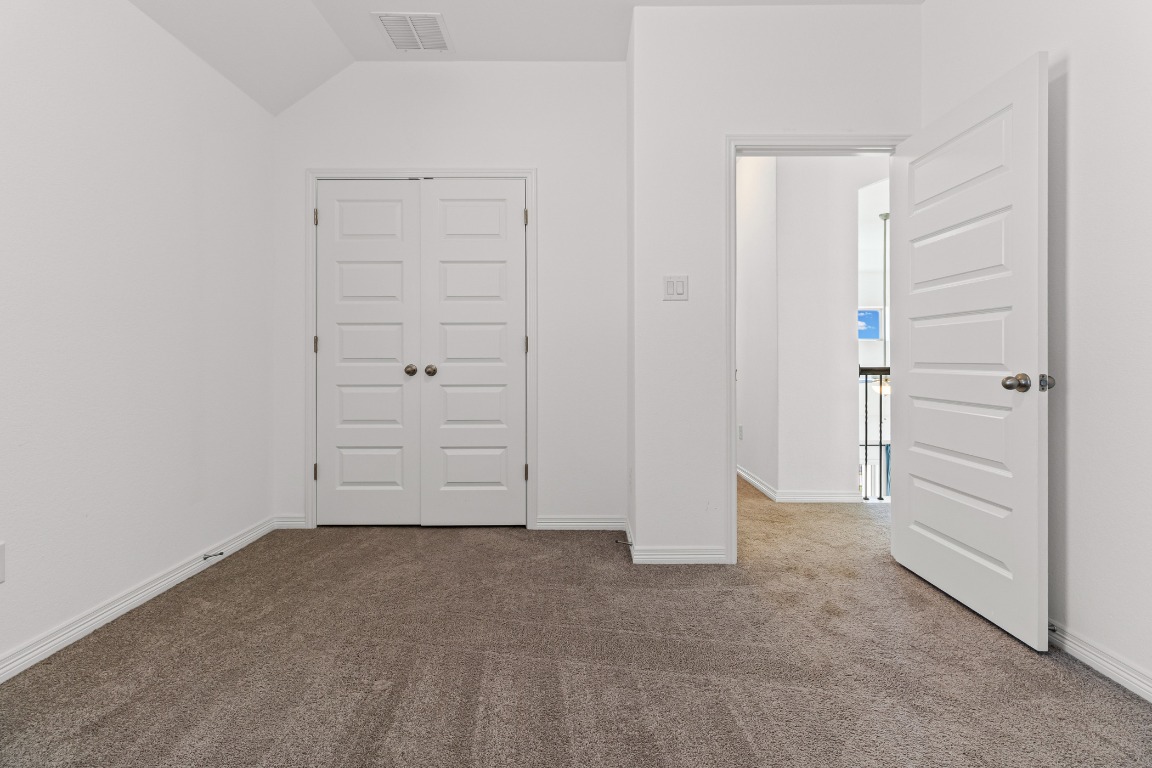 20520 Carries Ranch Road Pflugerville, TX 78660 - Photo 20 of 32 an empty room with closet area