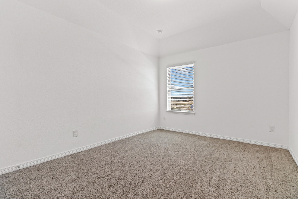 20520 Carries Ranch Road Pflugerville, TX 78660 - Photo 21 of 32 an empty room with a window