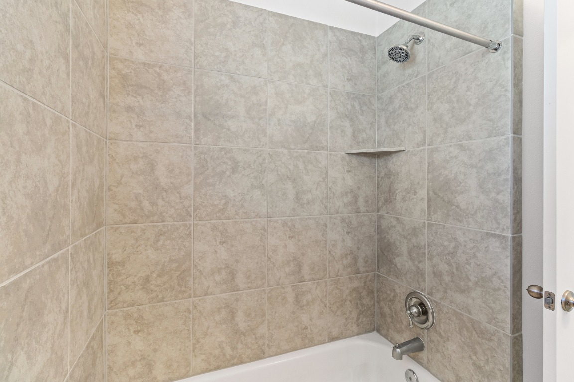 20520 Carries Ranch Road Pflugerville, TX 78660 - Photo 24 of 32 a bathroom with a shower and a sink